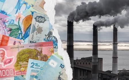 World currency next to smoke stacks