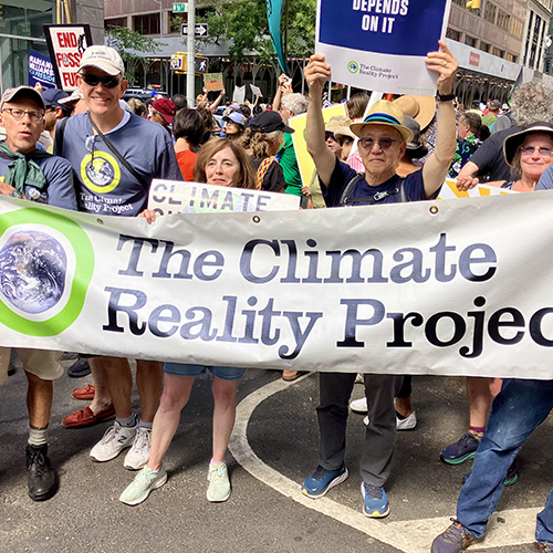 climate reality supporters at a rally