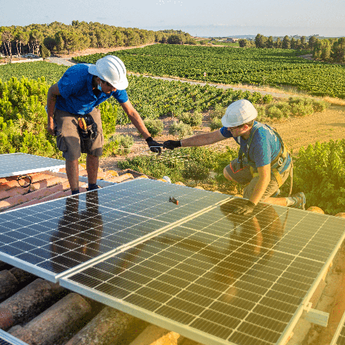 workers installing solar panels