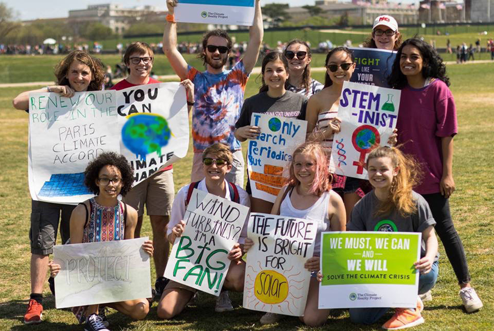 chapter members holding up sign