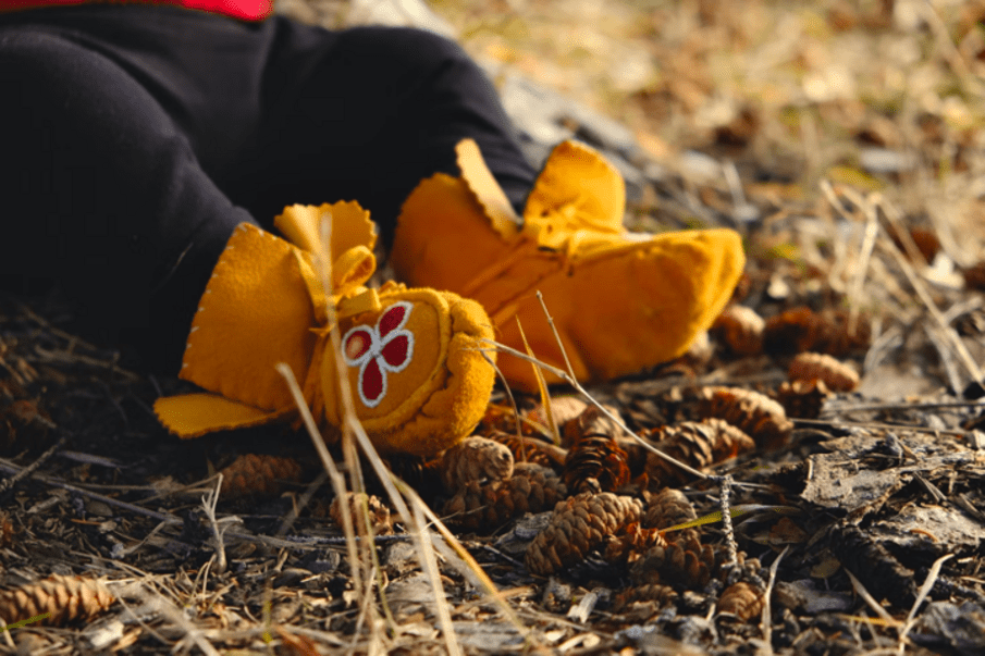 child in moccasins