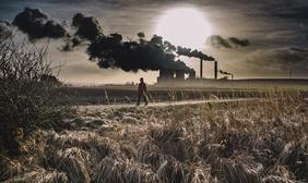 Person walking near a power plant