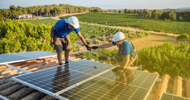 workers installing solar panels