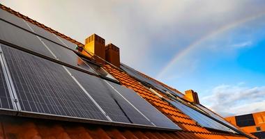 rainbow behind solar panel