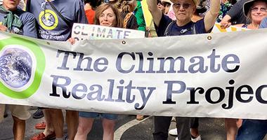 tile of climate reality supporters at a rally