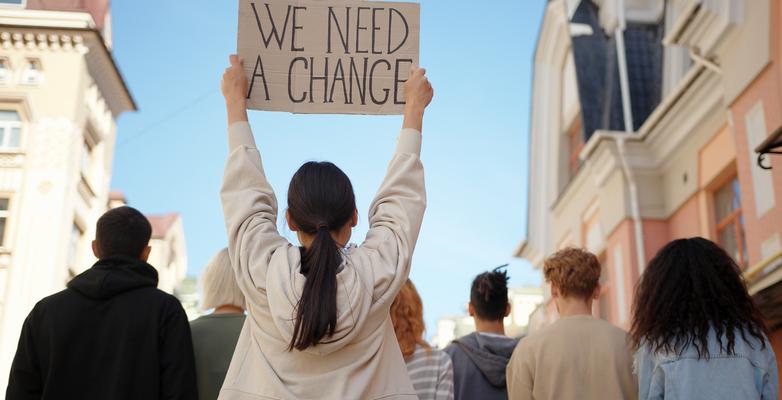 student protestor holding up a sign